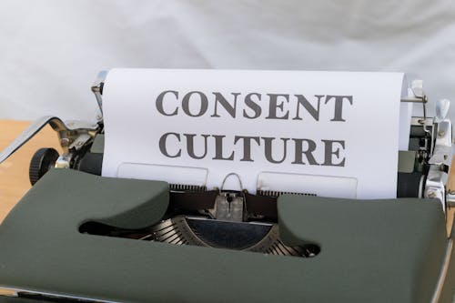 A typewriter with the word consent culture on it
