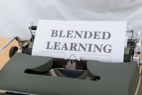 A typewriter with a paper that says blended learning