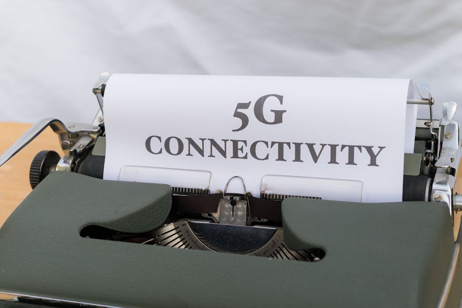 Close-up of a typewriter with a sheet of paper displaying '5G Connectivity', juxtaposing old and new technology.