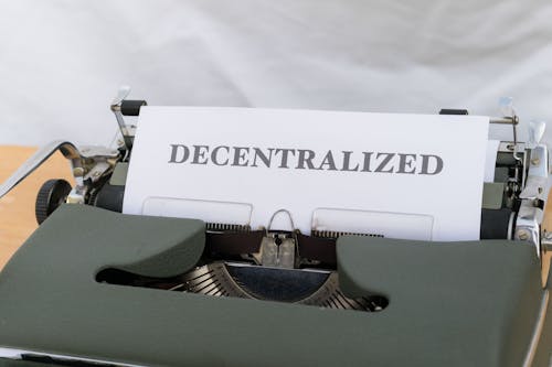 A typewriter with a paper that says decentralized