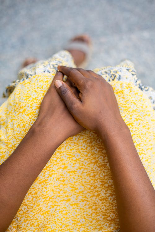 Woman Hands on Yellow Dress