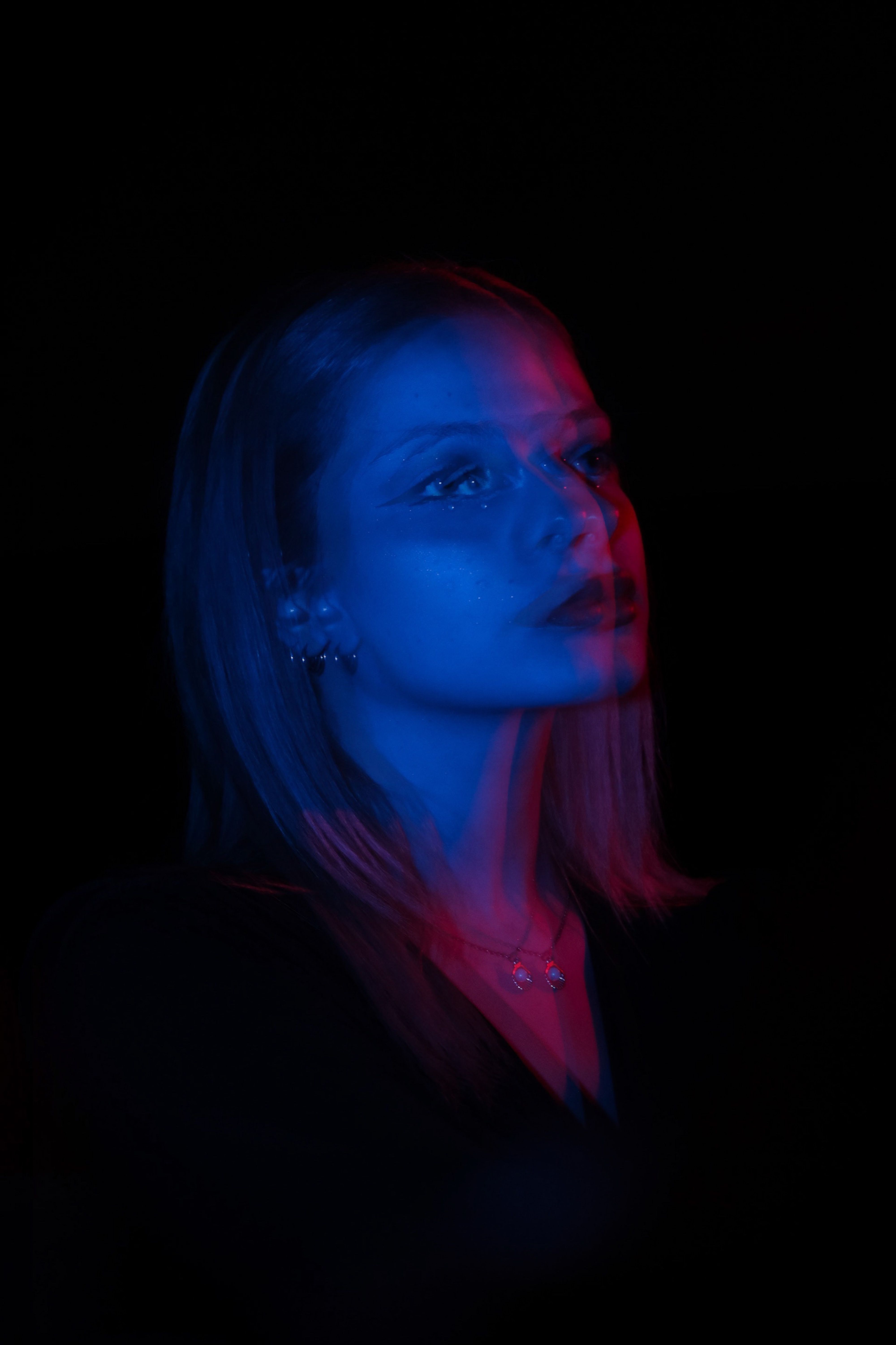 Blurred Portrait of Woman in Darkness · Free Stock Photo