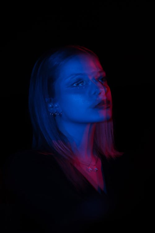 Blurred Portrait of Woman in Darkness