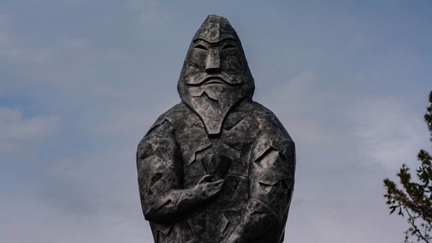 A statue of a man with a beard and a hat
