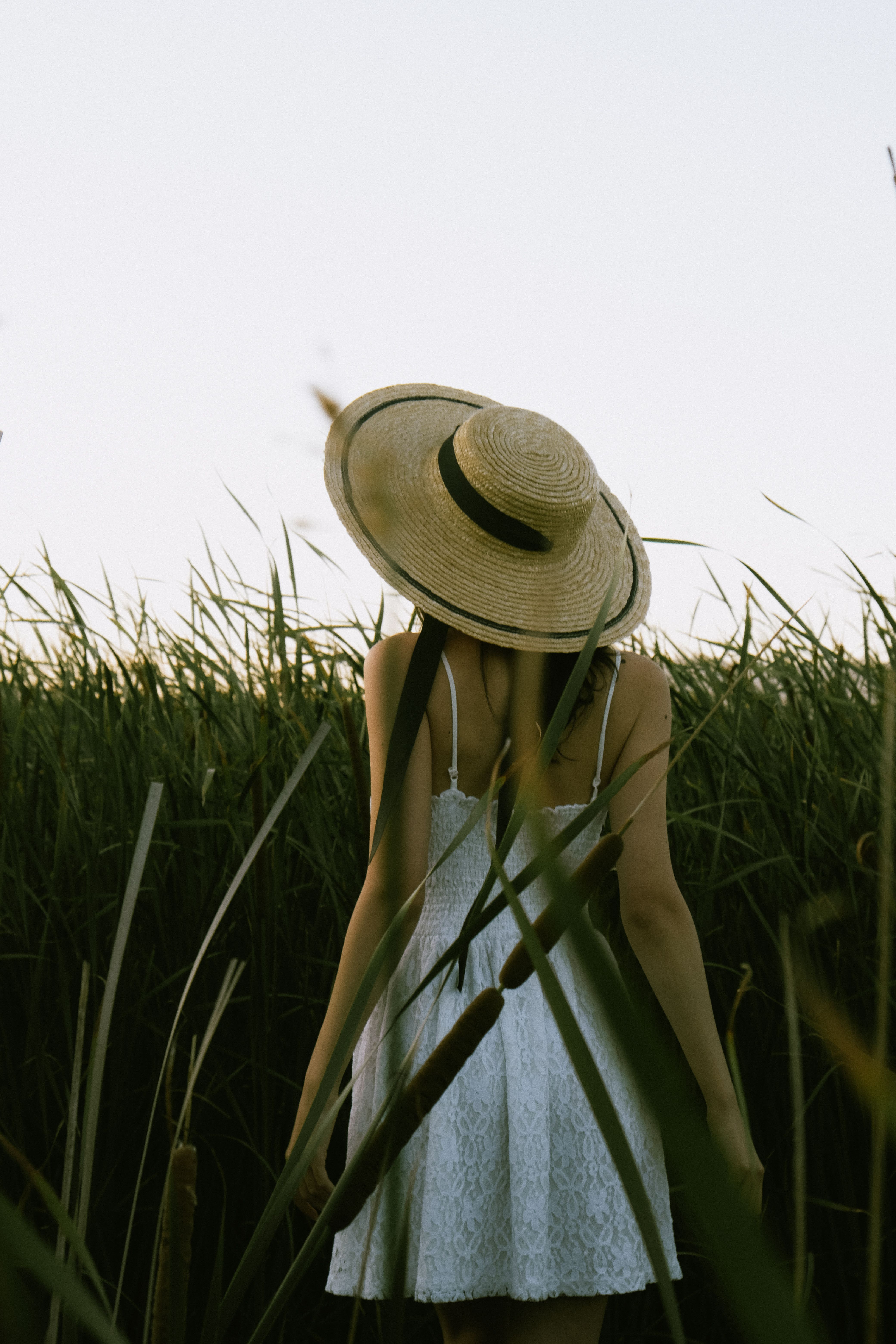 Woman in White Mini and Straw Hat in Field · Free Stock Photo