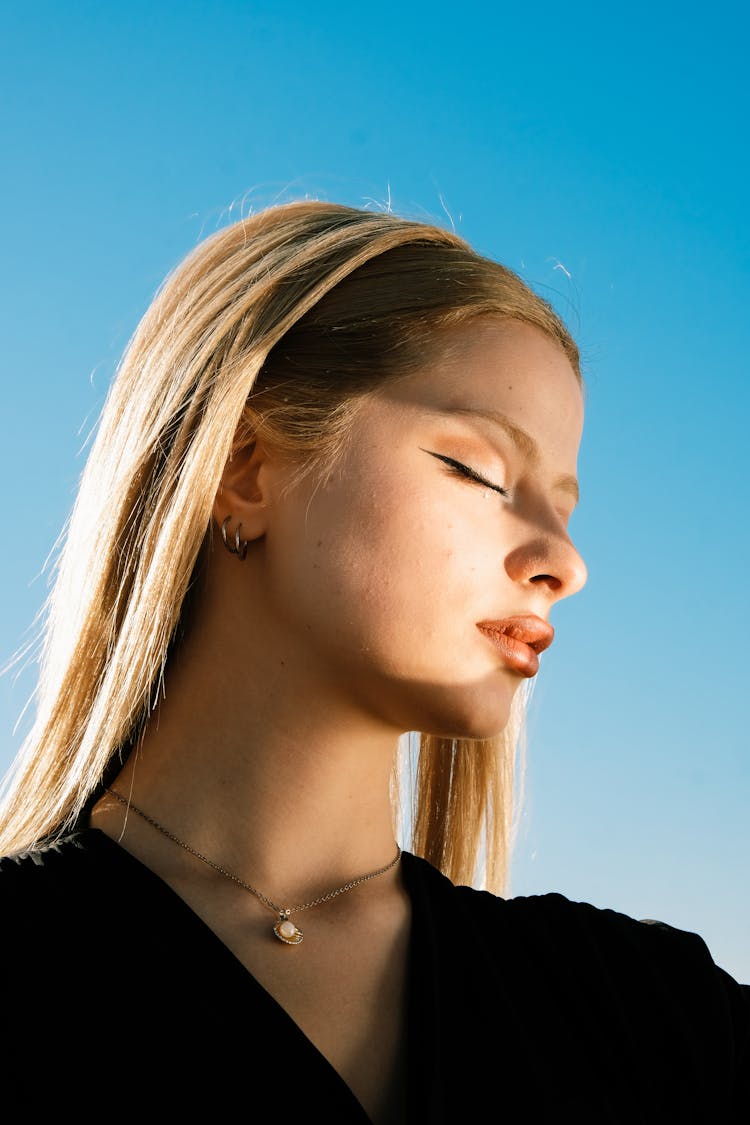 Beautiful Blonde Woman With Eyes Closed