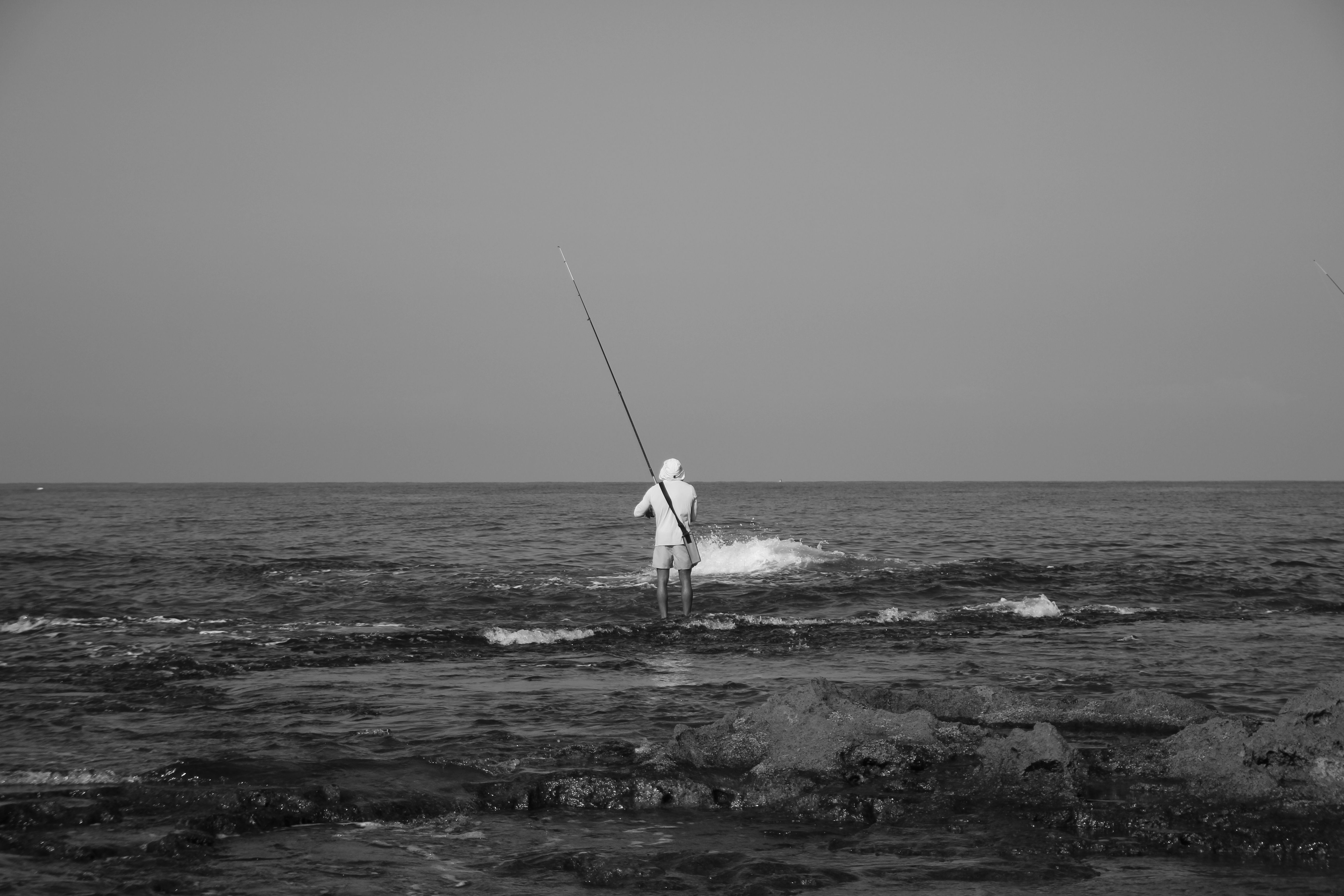Angler with Fishing Rod on Beach · Free Stock Photo