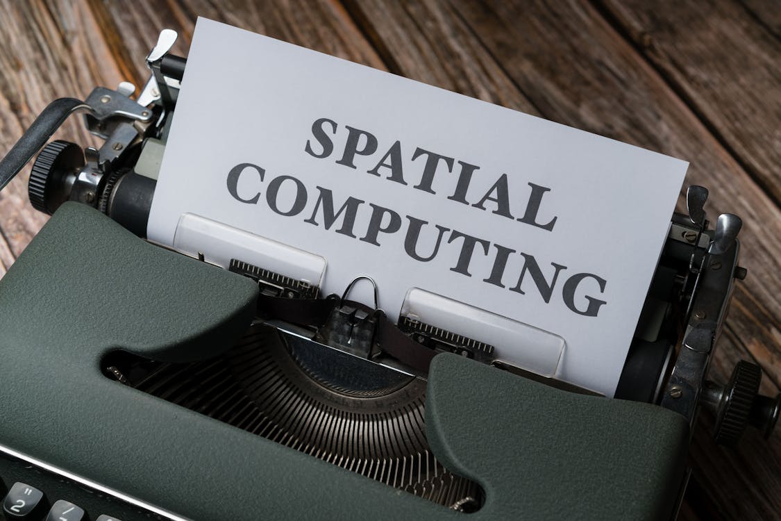 A typewriter with a paper that says spatial computing
