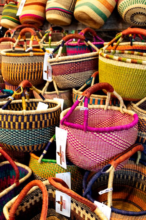 Free Vibrant handmade wicker baskets displayed in a bustling marketplace. Stock Photo