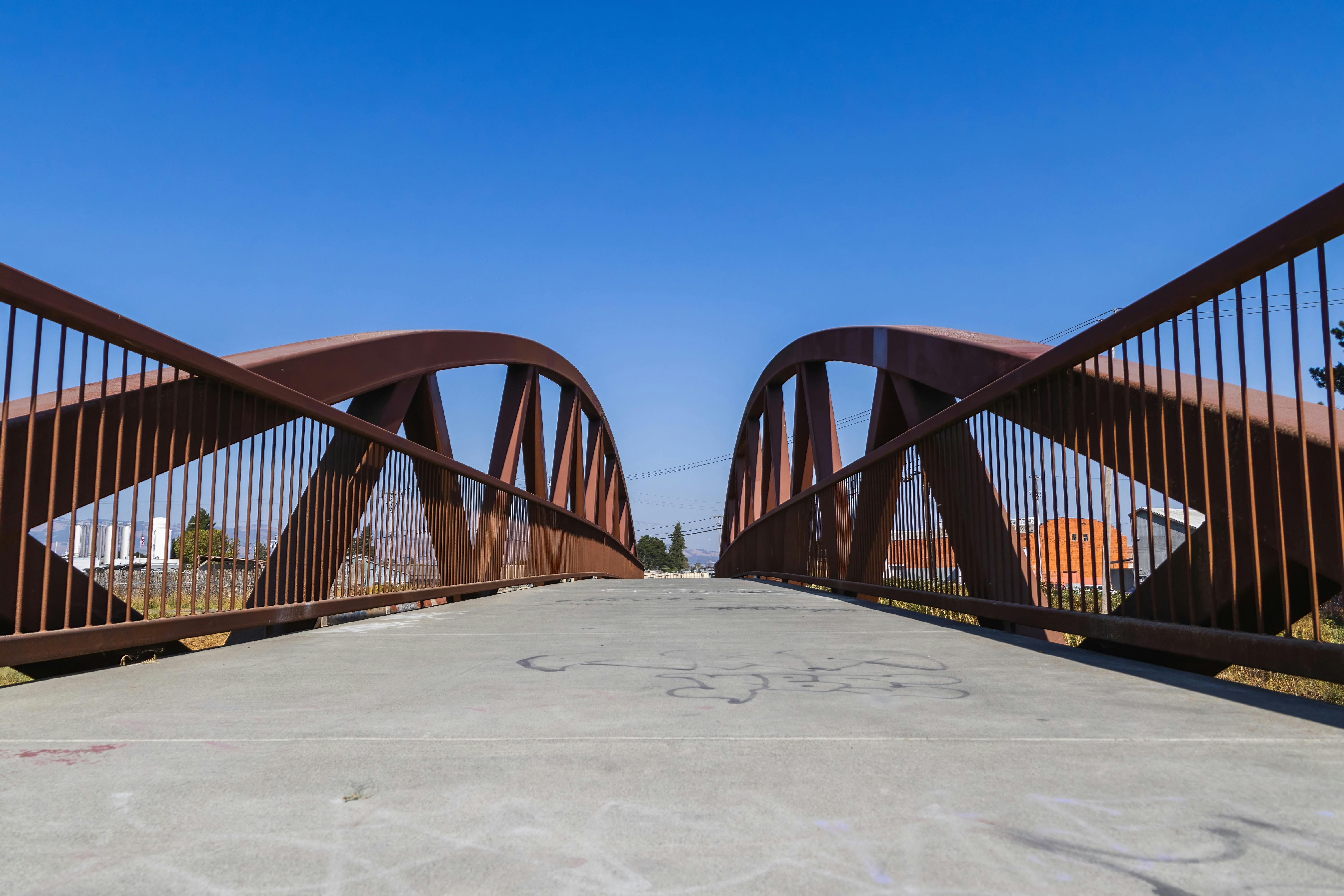 Urban Footbridge with Yellow Railing · Free Stock Photo