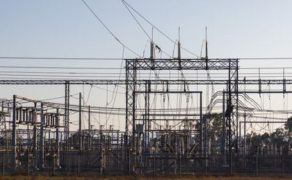 Grid-scale electrical yard at dawn, photo by Robert So on Pexels
