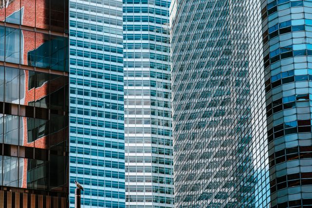 Glass office towers in a financial district, photo by Artem Zhukov on Pexels