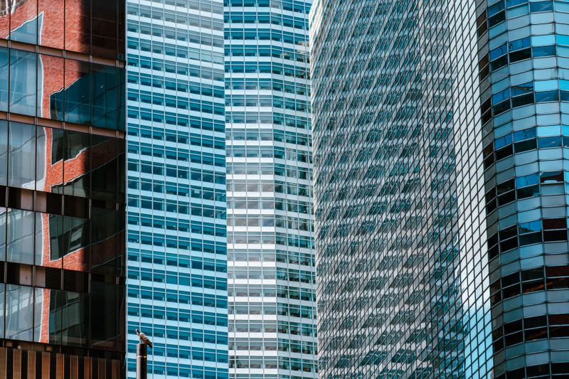 Glass facades of modern office skyscrapers