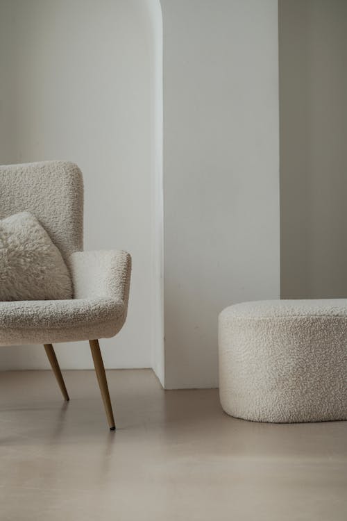 Armchair and Footstool with White Plush Upholstery