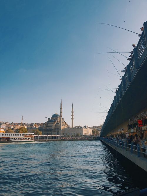 Free Scenic view of Istanbul's waterfront featuring a prominent mosque and bustling bridge. Stock Photo