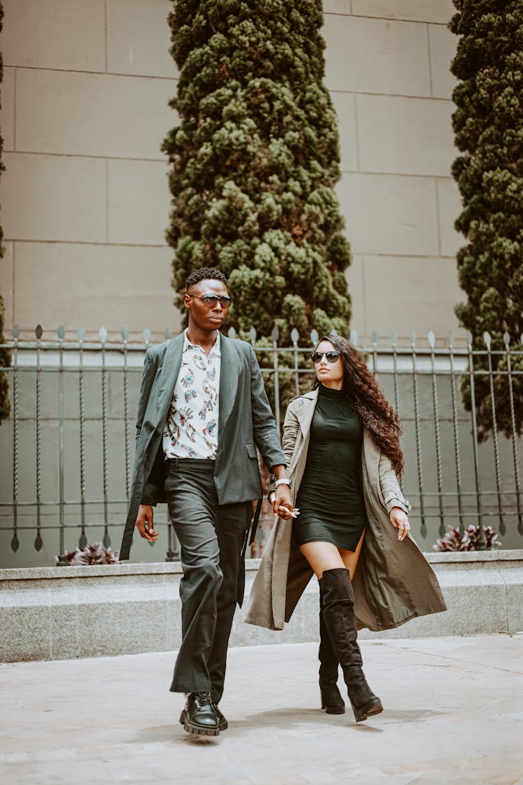 Couple Holding Hands And Walking Together