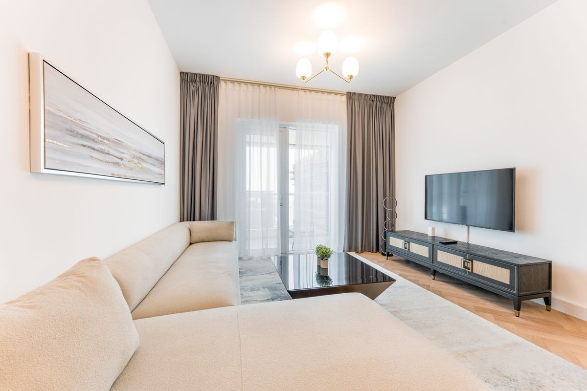 Modern living room sofa with bright interior styling