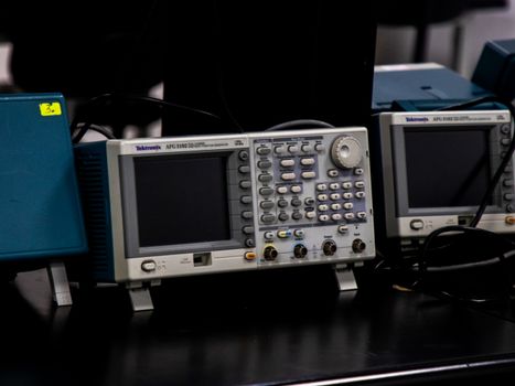 Close-up of electronic measuring equipment in a lab setting, showcasing precision technology.
