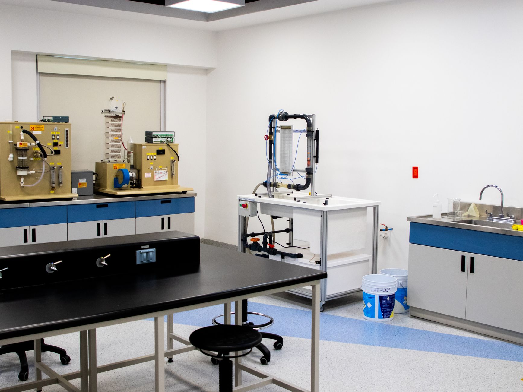 A well-equipped modern laboratory with industrial and healthcare research instruments.