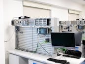 A computer room with a monitor and computer