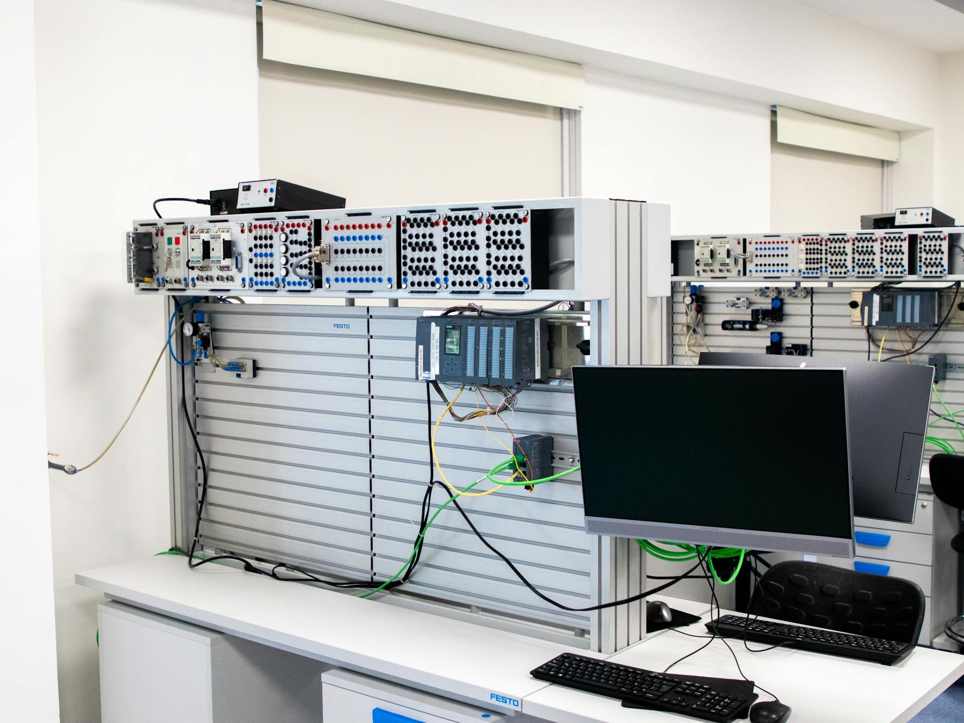 A computer room with a monitor and computer