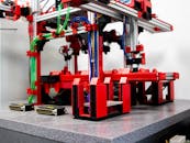 A red and black machine with wires and wires