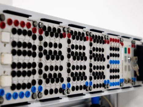 Detailed image of a modern industrial control panel featuring multiple connectors and buttons.