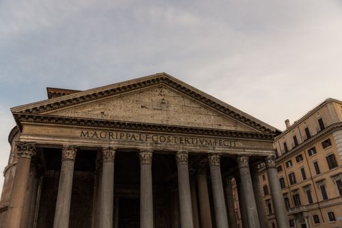 Free View of the Pantheon in Rome with classical architecture in the foreground. Stock Photo
