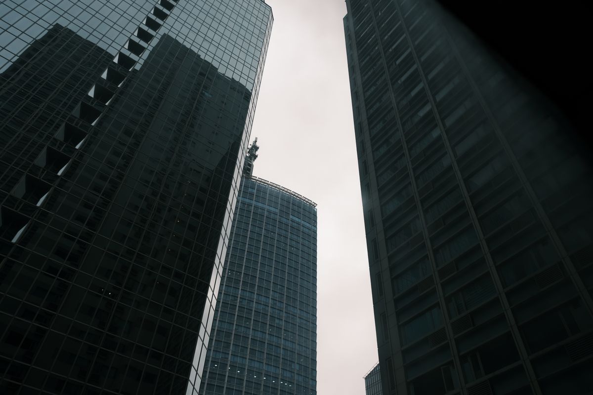 Modern skyscrapers and office towers under an overcast sky