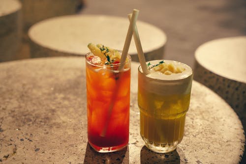 Free Cocktails with Straws Standing on a Table Stock Photo