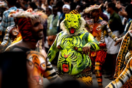 Colorful tribal festival parade featuring body-painted performers with tiger motifs and vibrant masks.