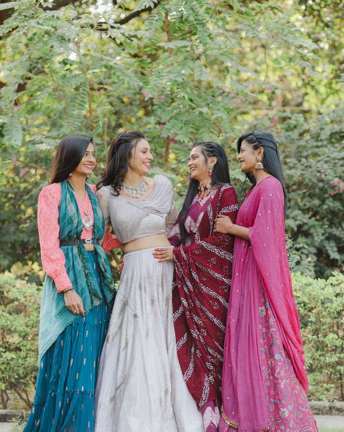 Women in colourful ethnic dresses celebrating