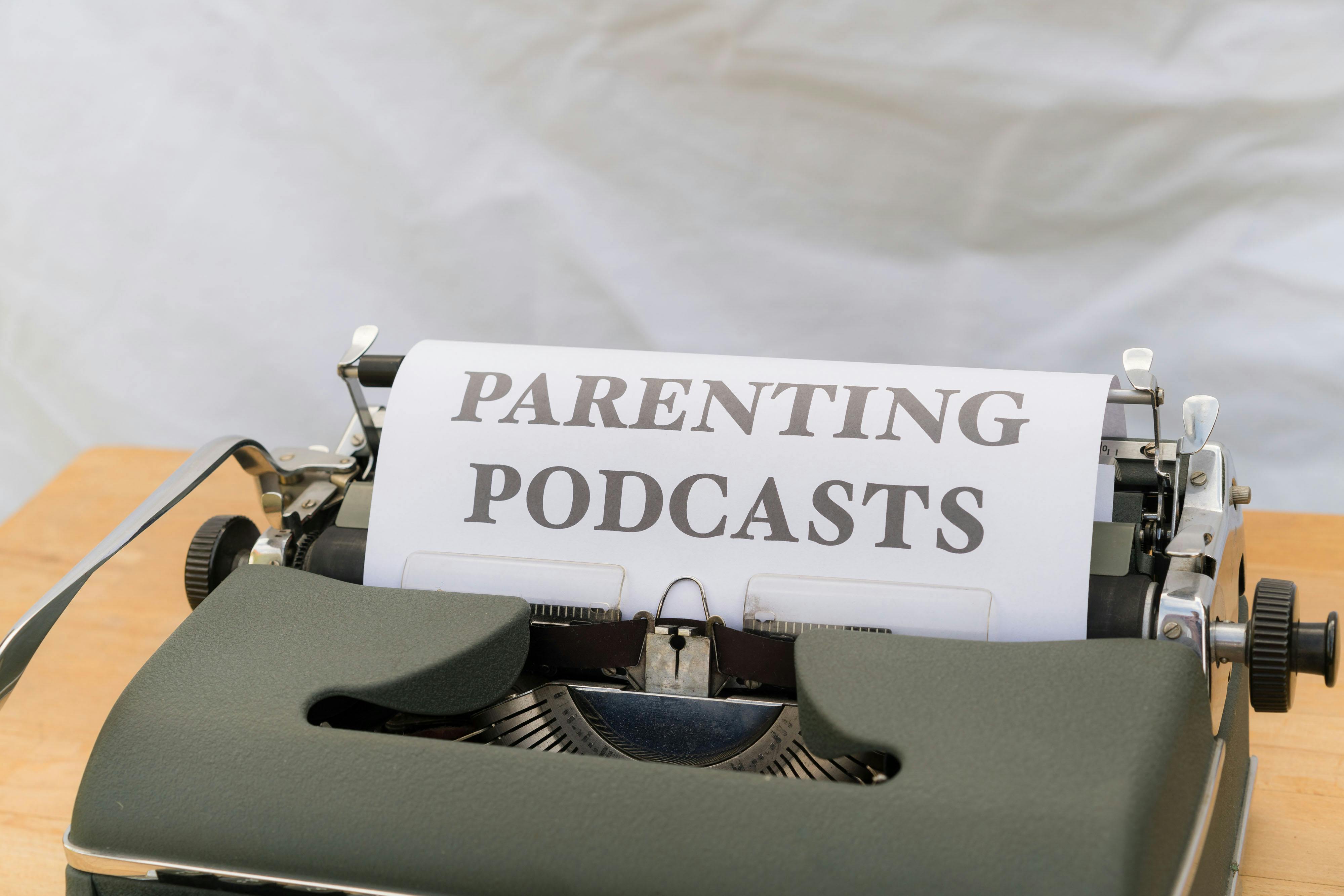 a typewriter with the words parenting podcasts on it