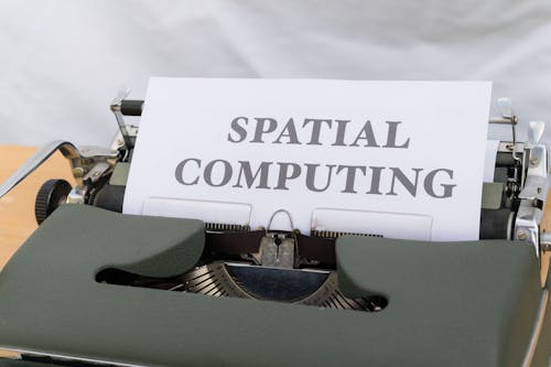 A typewriter with a paper that says spatial computing