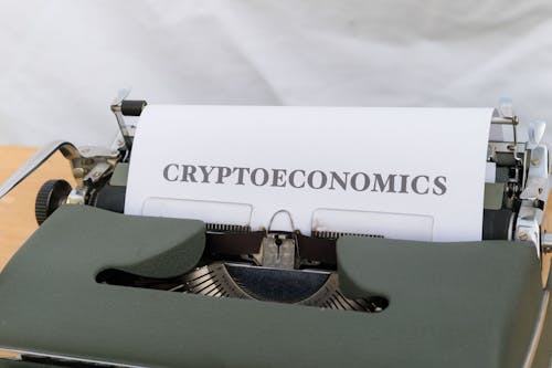 A typewriter with a paper that says cryptonomics