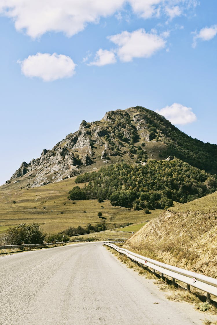 Road And Hill Behind