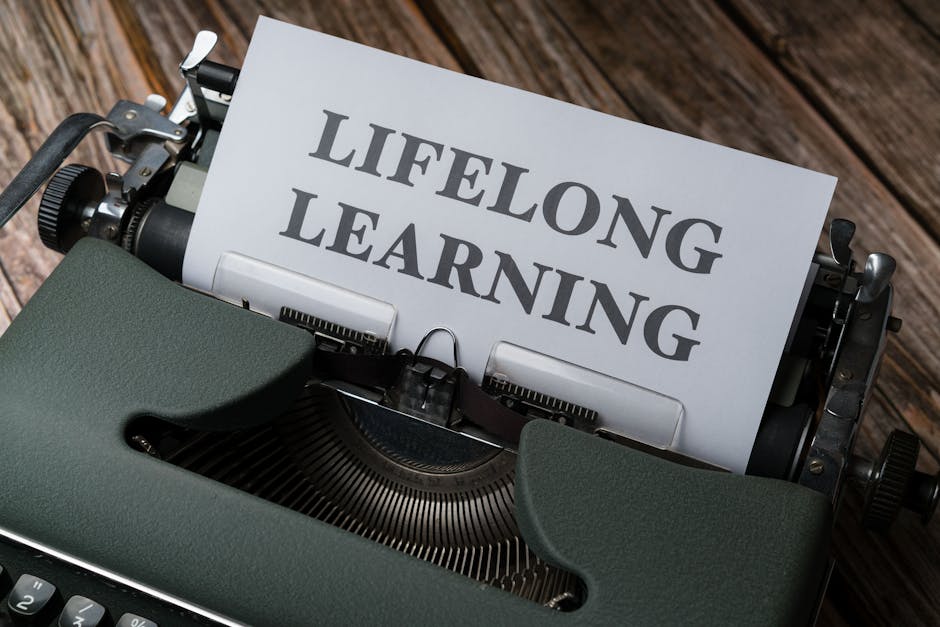 A classic typewriter displaying 'Lifelong Learning' on paper, symbolizing ongoing education.