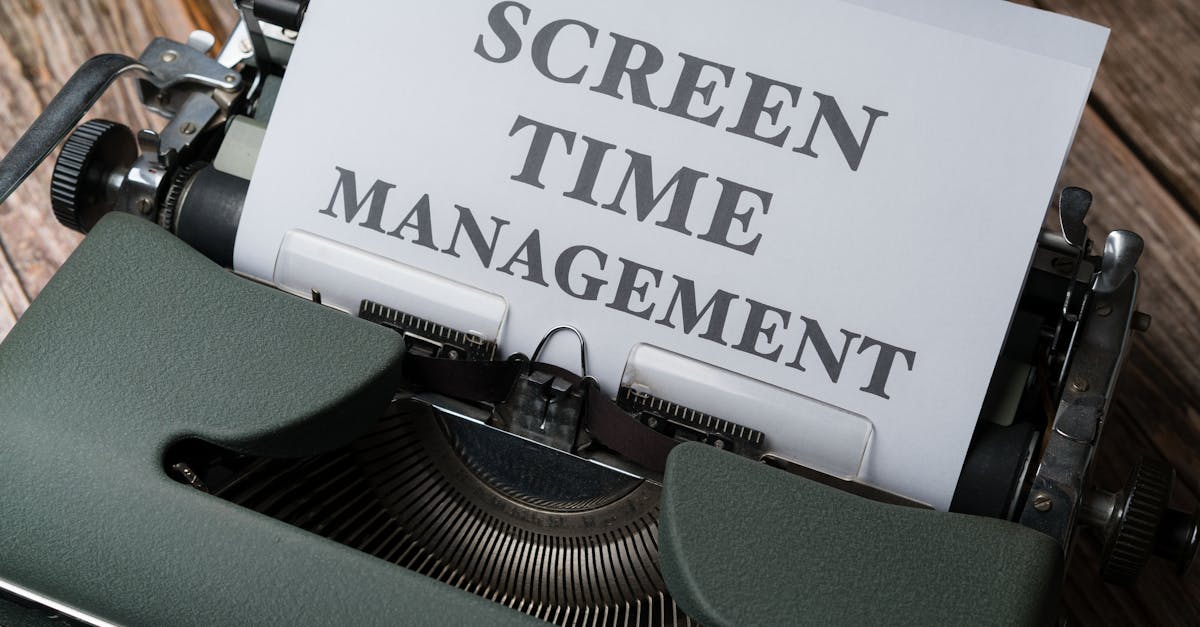 Vintage typewriter with 'Screen Time Management' printed on paper, emphasizing digital wellness.