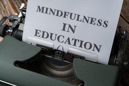 Close-up of a vintage typewriter with 'Mindfulness in Education' paper.