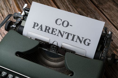 A typewriter with the word co - parenting written on it
