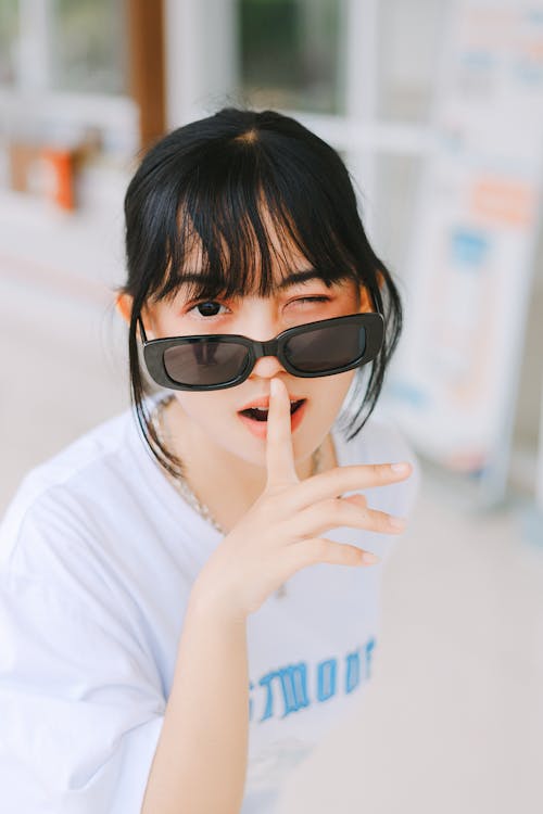 Portrait of a Pretty Brunette Wearing Sunglasses