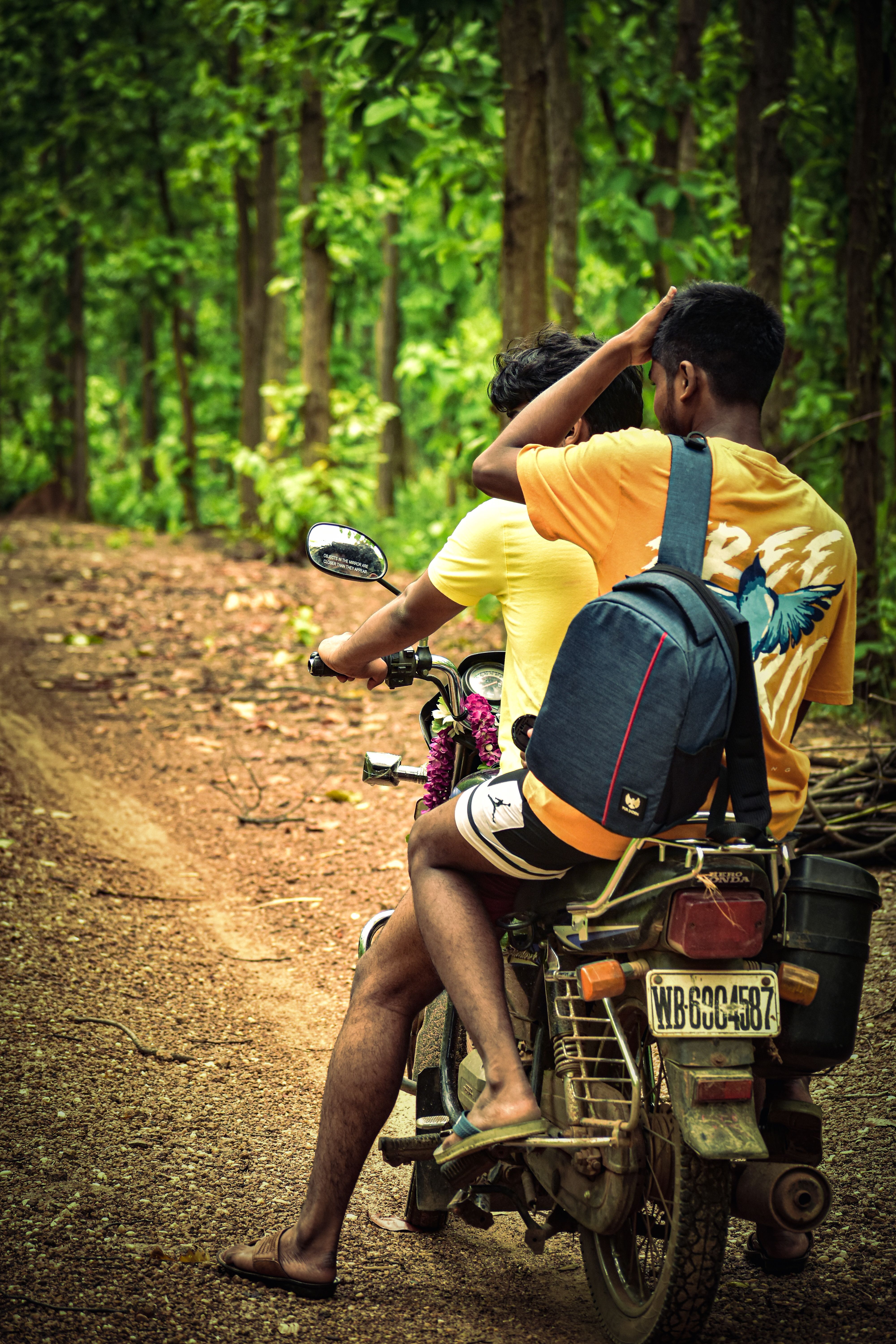 Two Men Riding a Standard Motorcycle · Free Stock Photo