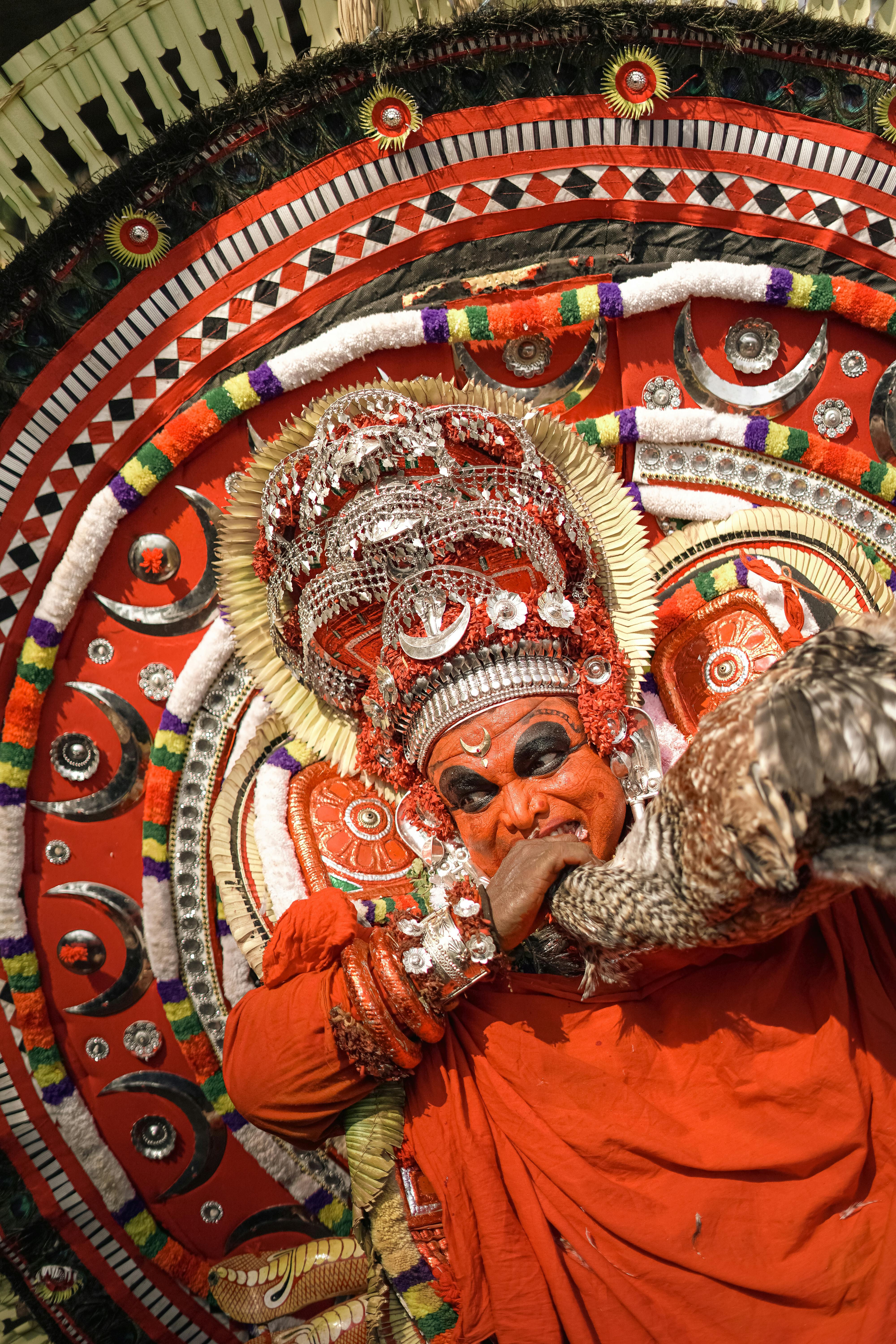 Intricate costumes and vibrant colors during Theyyam