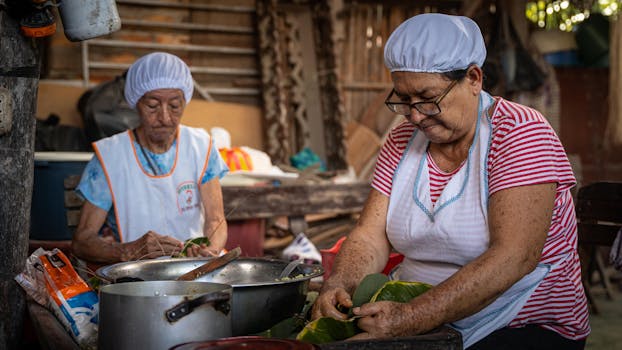 Women in San Martín, Peru, preparing traditional cuisine using local ingredients.