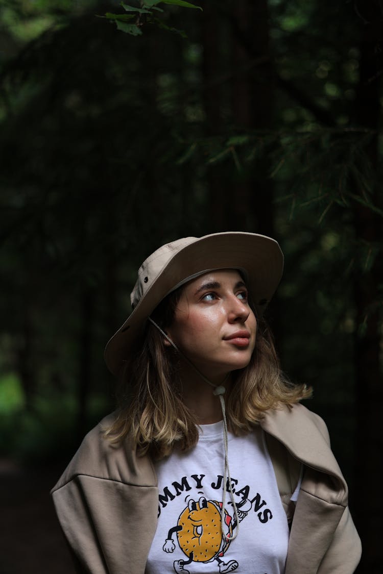 Woman In Tank Top With Print And Hat