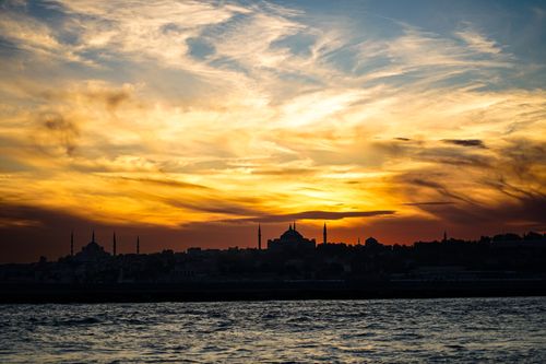 Free Stunning sunset view of Istanbul skyline with the silhouetted Hagia Sophia and a vibrant sky. Stock Photo