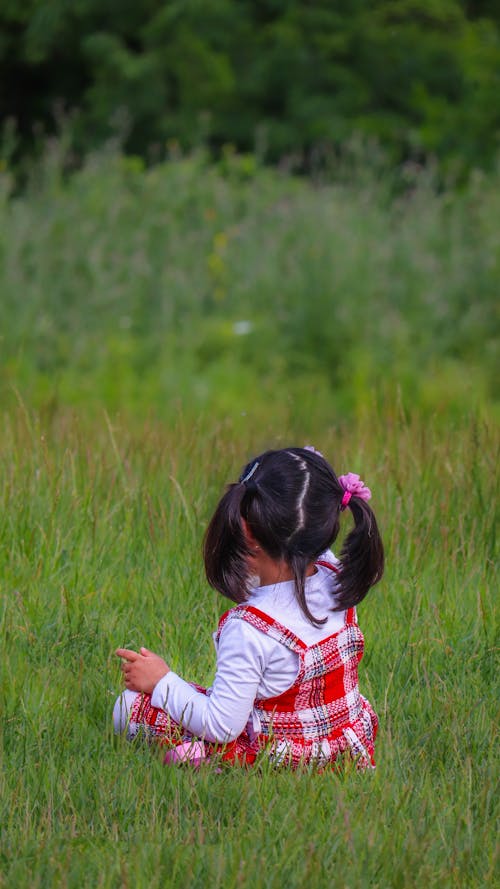 Girl Sitting in Grass