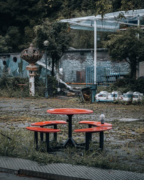 Outdoor Red Table and Seats on a Rainy Day 