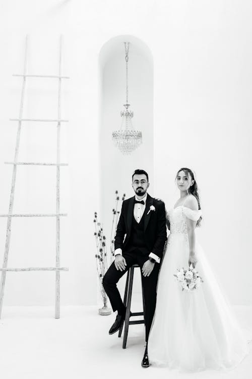 Newlyweds Posing Together on White Background