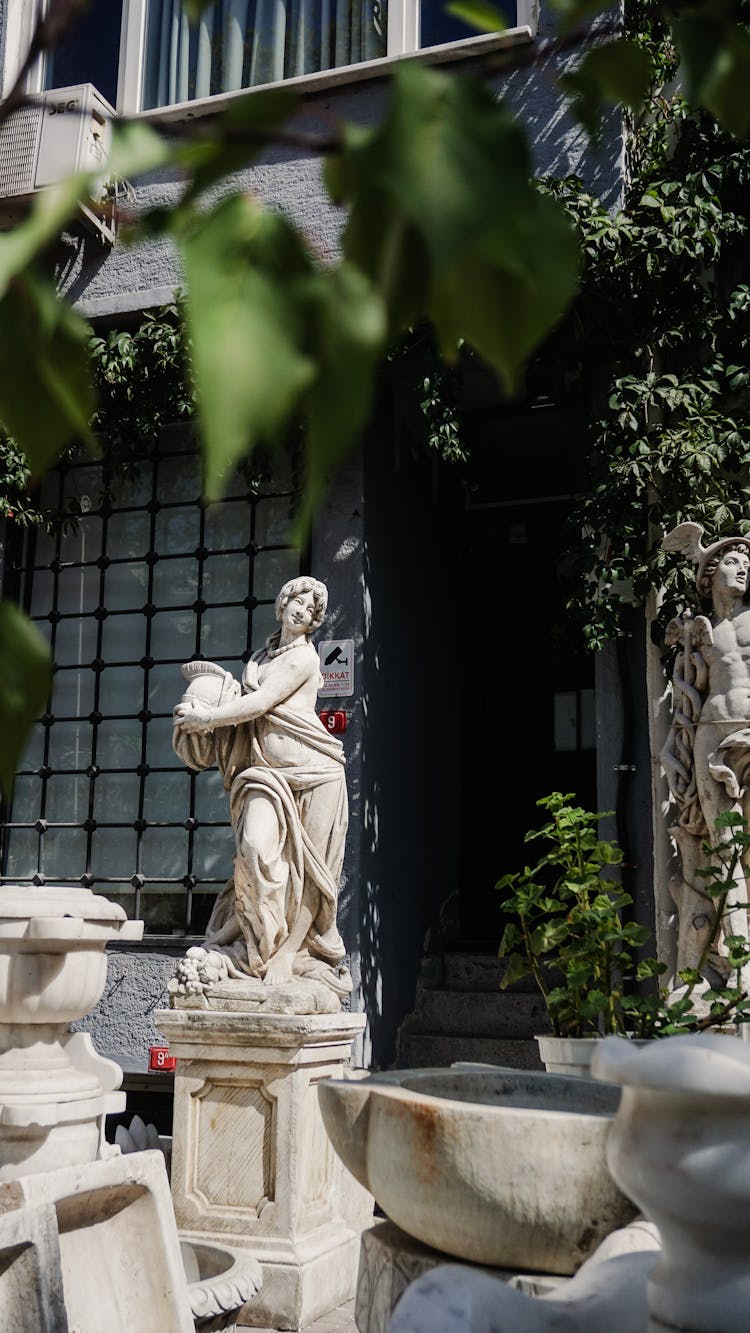 Marble Sculpture In A Garden